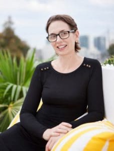 woman with glasses sitting