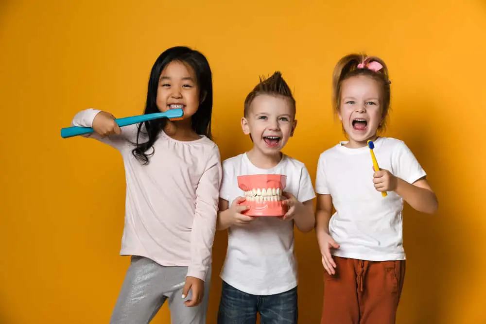 children with toothbrush