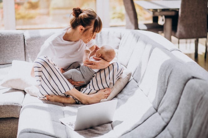 mother with kid working from home