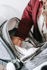 baby in grey carseat