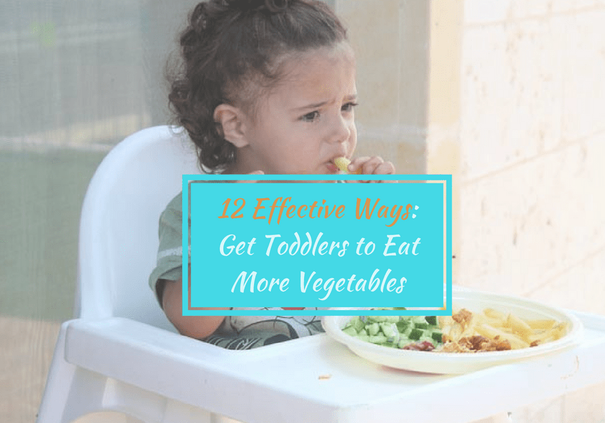 a toddler is eating vegetable with hand while seating in baby seat